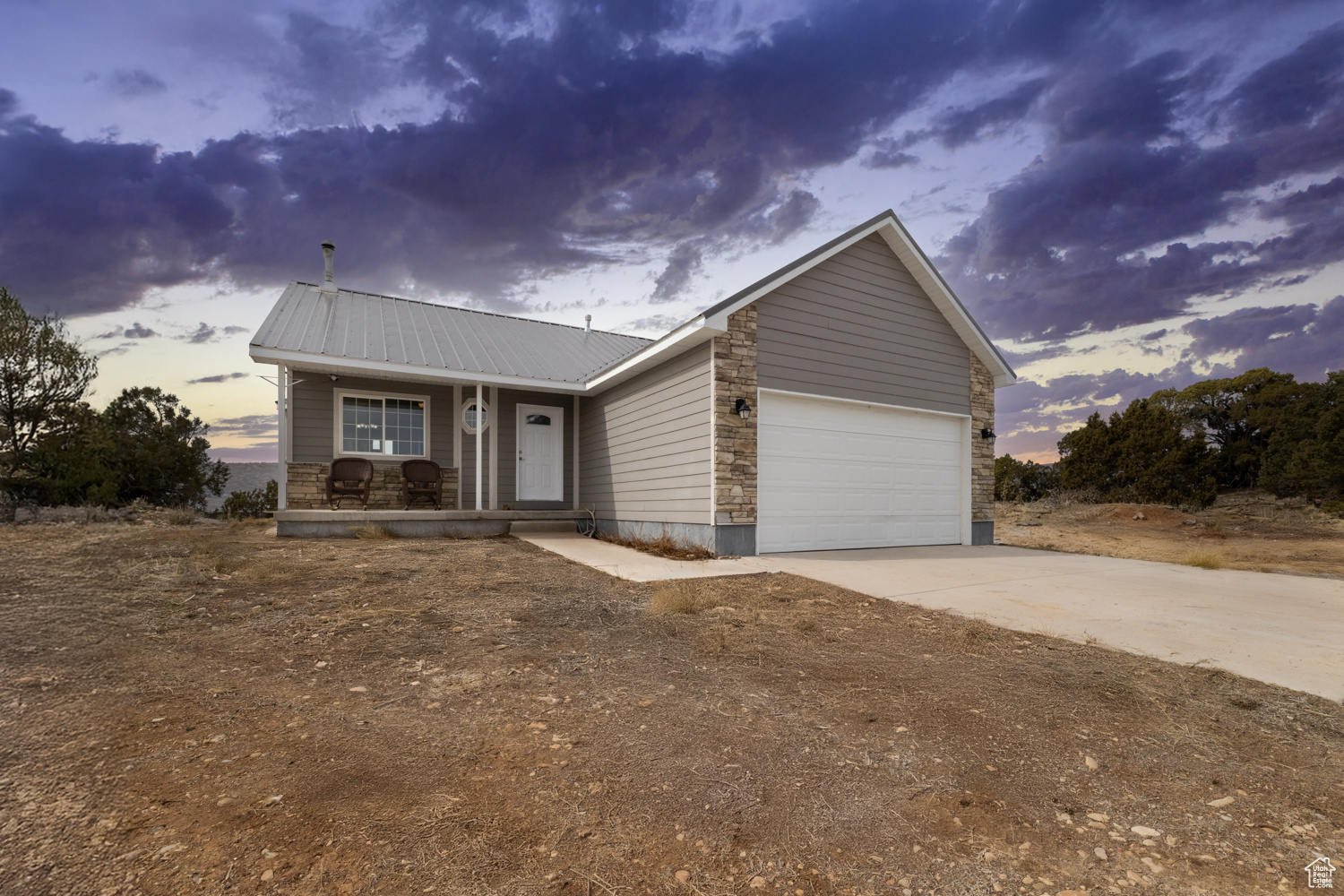 Escape to Nature with Comfort and Style! Nestled in the stunning landscapes of Bandanna Ranch in Fruitland, Utah, this outdoor enthusiast's dream offers a unique blend of comfort and nature. As you enter the house, natural light floods the open floor plan, accentuating the vaulted ceilings and creating a warm, inviting atmosphere. The living room boasts a cozy wood stove, perfect for relaxing after a day of exploring the scenic surroundings. The basement is ready for your finishing touches, with electrical, plumbing, framing, drywall, and primer already done! Enjoy your mornings on the covered patio as you soak in the 360 degree scenic views of nearby mountains. The property offers breathtaking views of Tabby Mountain, Bobby Duke Ridge, Currant Creek Mountain, Twelve Hundred Dollar Ridge, Strawberry Peak, Gray Wolf Mountain, Buckhorn Knoll, and Square Top Mountain. Designed for both beauty and safety, it features fire-resistant siding and an existing firebreak, providing peace of mind in this beautiful yet wild environment. In a 30x20 garden protected by a 6-foot fence, you can cultivate your green thumb surrounded by hollyhocks, mint, and sunflowers. Walking, ATV, and horse trails right at your doorstep provide endless opportunities to explore the open air. For water lovers, top fishing and recreation spots are just minutes away30 minutes to Starvation Reservoir, 40 minutes to Strawberry Reservoir, 15 minutes to Red Creek Reservoir, 45 minutes to Currant Creek, and 45 minutes to Strawberry River. As you explore the expansive 5 acre property and surrounding areas, you're bound to run into some of the local wildlife including elk, deer, bobcats, moose, chickadees, turkeys, owls, golden and bald eagles, red tailed hawks, and foxes. Massive bucks are often visible from the dining room window. Don't miss the opportunity to own this unique property that seamlessly blends indoor luxury with the beauty of the great outdoors! Square footage per country records. Boundary lines in photos is just an estimate. Biking trails, hiking trails, horse trails, etc are not part of the HOA. Buyer to verify all information.