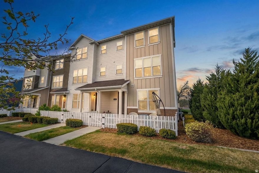 *OPEN HOUSE SAT APRIL 11TH 12 - 2PM* End-unit. Former model home. Even more character & charm added. And it shows! This stunning 4 bed, 4 bath townhome in Bluffdale offers the kind of elevated living that blends style, comfort, and everyday functionality. Flooded with natural light and positioned to capture beautiful mountain views, this home is perfect for those who appreciate thoughtful design and a space that truly feels like their own. Originally the community's model home, it features upgraded finishes throughout including two-tone soft-close cabinetry, quartz countertops, a gas range, and a cozy electric fireplace that anchors the main living space. Since then, even more character has been added including hand-scraped hickory flooring, textured carpet, modern lighting, wood accents, floating shelves, a barn door, and a designer tile backsplash which creates a warm, custom feel you don't typically find in townhomes. Step out onto your private balcony and take in the mountain views on summer evenings, or enjoy the ease of low-maintenance living with quick access to major commuter routes. With a 2-car garage, spacious layout, and a level of care that truly stands out, this home is just as functional as it is beautiful. If you've been waiting for something that feels a little more elevated than the rest-this is it.