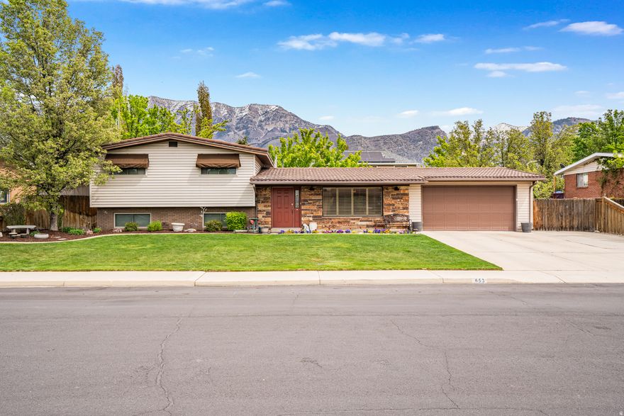 OPEN HOUSE SATURDAY APRIL 18TH FROM 11:00 AM TO 2:00 PM.  DON'T MISS IT! LOCATION, LOCATION, LOCATION! This quiet, comfortable, and convenient home is smack dab in the heart of Orem. Located only a few blocks away from all of the amenities including: University Place Mall, Costco, restaurants, banking, schools, churches, shopping, entertainment, outdoor activities and more. Quick access to BYU and UVU. Scera Park movie theater, park, amphitheater and pool are only a few blocks away. Within minutes to the mountains to enjoy hiking, biking, camping, skiing, boating, fishing, winter sports and more. ALL THAT SAID...the best part of this deal is the HOUSE! Well cared for and beautifully maintained over the years. Improvements include a spacious, functional & beautiful updated kitchen, remodeled bathrooms, newer furnace, AC, water heater, and updated 50 year metal roof. You'll love to entertain with a secluded backyard that features a shed, garden boxes, & mature, well maintained landscape. The highlights in the backyard included an extra large, relaxing covered patio which becomes an extension of the home; an entertainers dream. Best is an incredible detached 22' x 28' garage with heat that can serve multiple purposes including: workshop, she-shop, man-cave, storage, garage for cars, toys, boat, watercraft, snowmobiles, motorcycles, side by sides, etc. Additionally there is RV parking for trailers and campers.  The basement entrance give the possibility of a future ADU and there is space for an additional bedroom. The large room in the basement could serve as a bedroom or a 3rd family room. A must see. This one will go fast. Don't hesitate, call today.  Buyer to verify all information.