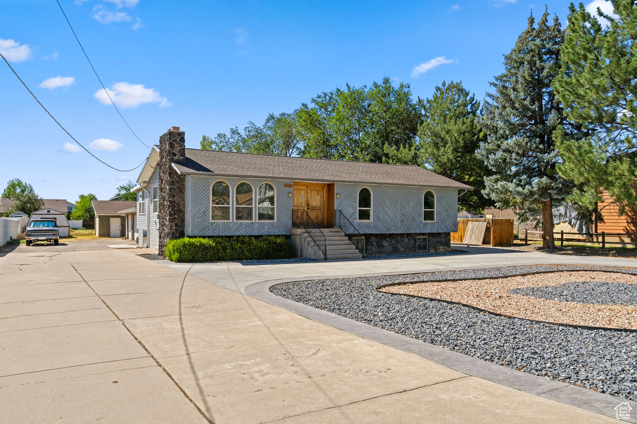 Spacious, flexible, and built for life; there is so much potential! This 6-bed, 3-bath home pairs big interior spaces with serious garage capacity and nearly a full acre of land. The walkout basement already has a kitchen rough-in-ideal for multigenerational living, a future mother-in-law suite, or a private guest space with its own entrance. Tackle projects year-round in the heated detached 3-car garage, and stash the toys, tools, or extra vehicles in the second extra-deep garage/shop. The lot has so many options: garden, keep animals, or explore subdividing for additional lots or a family compound (subject to city/county approval). Properties with this blend of space, utility, and upside don't come along often-bring your vision and make it yours.