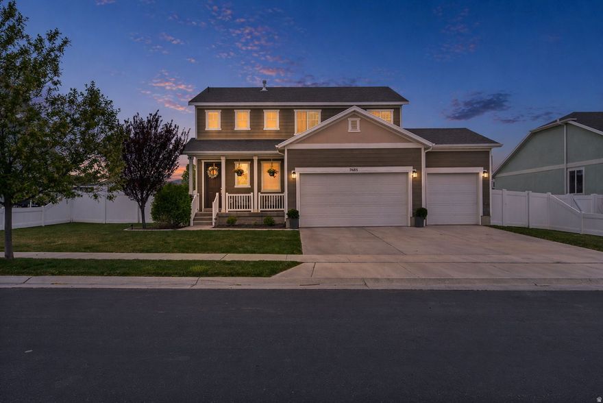 Beautiful 3 bed 2.5 bath Eagle Mountain 2-story with NO HOA and a 3rd car garage! Step inside and you are greeted by an open concept layout with an abundance of natural light. The main level features 9 ft ceilings with 8 ft doors offering a grand feel that is perfect for entertaining! The sleek kitchen features dark cabinetry contrasted by light quartz countertops and stainless steel appliances. Upstairs you'll find 3 spacious bedrooms. The primary bedroom has an attached ensuite with a large shower, walk in closet & double vanity sinks. The fully fenced yard has been meticulously maintained and thoughtfully designed, featuring elegant curbing, well-placed landscaping, and a spacious lawn. Mature and strategically planted trees, especially along the rear of the property, offer additional privacy and natural beauty. An extended concrete patio creates the perfect setting for outdoor dining, entertaining, or relaxing, while still leaving plenty of room for play and open space. This is the home you've been waiting for, schedule your showing today!