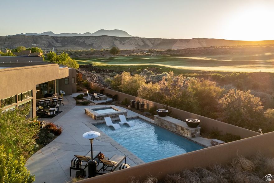 Absolutely stunning home in the gated community of the Ledges of Saint George with unobstructed views of the 16th fairway, and the beautiful white rocks of the Red Cliff National Conservation Area. Enjoy the surrounding striking views from almost every room through the tall panoramic windows. At the entrance, you are welcomed by a nicely secluded courtyard that leads into the home. The open floor concept combines elegant contemporary high-end finishes with timeless warm tones. The tall ceilings and windows allow you to soak in every single ray of light with the elegantly finished fireplace and entertainment center built-ins with wide ship plank back splash. The wide LVP Hardwood floors lead you into the beautifully designed kitchen with quartz countertops, built-in refrigerator, double ovens, large pantry, floor-to-ceiling cabinets, large kitchen island with sink, contemporary high-end light fixtures, primary bedroom with tall windows, large walk-in shower with a soaking tub inside, and extra roomy closet. Other amazing features in the home include 4 spacious bedrooms including the casita, 4.5 bathrooms, separate office, 3 car garage with 1,159 SqFt of space, large laundry room, and all of this on 0.37 acres. Retreat to your very own exterior oasis with a great pool that features a shamu shelf, water fall feature, fire feature, and spa. The recently completed outdoor kitchen features a built-in barbeque, bar area, and TV system. Enjoy the most breathtaking sun rises by your built-in fire pit or watch the sun glisten as it bathes the mountains to the east with its shine in the evening. There is no better way to stay cool in the warm summer than to have your yard facing the correct way.  On the bench above Snow Canyon State Park, less than 15 minutes north of the city of Saint George. This property is also a short drive to some of America's most breathtaking destinations, including Zion National Park, Bryce National Park, and the north rim of the Grand Canyon. Other nearby state parks and national forests, include Sand Hollow Reservoir, Gunlock Reservoir, Quail Creek Reservoir, and Dixie National Forest that enhance the allure of the location. With over 300 days of sun, incredible year-round weather, and in the middle of a 7,200 yard par 72 golf course designed by Matt Dye, there is no doubt that The Ledges is one of Southern Utah's best kept secrets. One of the best places to live for those that love the outdoors, biking, hiking, fishing, ATVing, and all other high desert adventures.  All information herein is deemed reliable but is not guaranteed. Buyer is responsible to verify all listing information, including square feet/acreage, to buyer's own satisfaction.