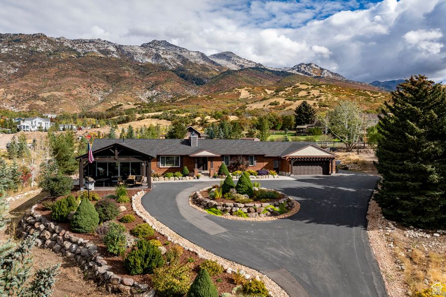 This exceptional 1.74-acre building lot sits adjacent to the highly sought-after 3 Falls Subdivision at the base of Lone Peak in Fort Canyon. Surrounded by thousands of acres of U.S. Forest Service land and expansive open space, the property offers endless opportunities for hiking, biking, and horseback riding right outside your door. With no HOA, animal rights, and a private well already on site, this lot provides both flexibility and convenience. Two separate entrances make it easy to store and access equipment, vehicles, or recreational toys. The grounds are beautifully enhanced with mature landscaping, including more than 30 established fruit trees and stately pine trees lining the perimeter. A well-maintained home currently sits on the property, ideal for rental income or comfortable living while you design and build your dream home.