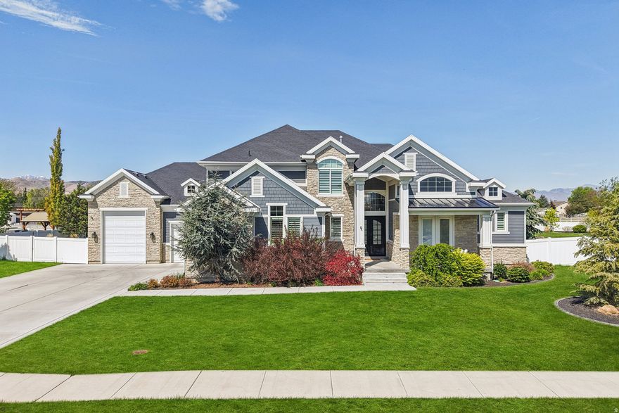 Rare Bluffdale property with the space, layout, and features that are hard to find at any price point. The massive yard and outdoor living setup create a true entertaining experience with a covered patio, gas fire pit, lower walk-out patio, and additional gas hookup ready for a future fireplace. Inside, the home was designed for both luxury and everyday function with a butler pantry-style kitchen, pebble ice maker, private front office, main-level laundry plus a second laundry upstairs near the bedrooms, and a dramatic modern metal entry door. The extra-tall, extra-deep 5-car garage offers exceptional space for vehicles, storage, toys, or a workshop setup. The basement is nearly finished and already wired for a future theater room or golf simulator, one of today's most sought-after luxury features. Located with quick access to Bangerter Highway, I-15, and the Silicon Slopes corridor, this home combines privacy, space, and commuter convenience in one of Bluffdale's most desirable areas. Owner related to agent.