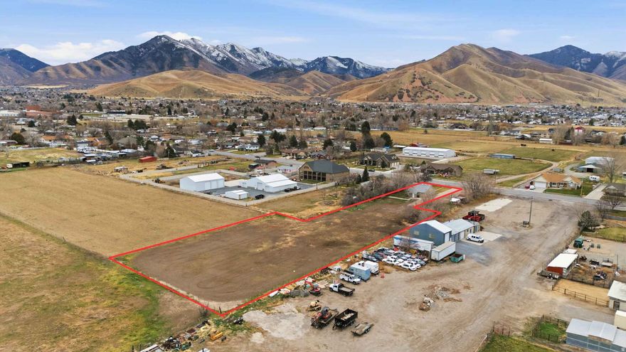 Tooele City Horse Property with high quality remodeled farm style  home, and room for your new barn, corrals, and workshop! Zoned for livestock.  There is a Settlement Canyon Irrigation hookup on property but, no shares go with sale. Possible to lease from Company. Great westside location with easy access.