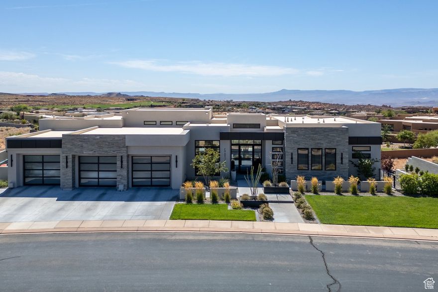 Entering through the striking metal-glass front door into a bright, open floor plan filled with tall glass sliding doors and modern fixtures that take in plenty of natural light and the surrounding sweeping mountain vistas. The kitchen is a showstopper with floor-to-ceiling cabinets, double waterfall quartz island, premium finishes, and 14' ceilings . A flexible gym or 4th bedroom comes with its own bath, while the spacious primary suite boasts large windows, a soaking tub, shower room with double shower heads, quartz double sinks, and a massive walk-in closet. Stackable sliding doors in both the living room and kitchen create seamless indoor-outdoor flow to the backyard retreat-complete with a sparkling pool and Shamu shelf, gazebo, pickleball court, fire pit, and in-ground trampoline. Three individual garage bays provide plenty of parking and storage. This is a modern entertainer's dream with all the right touches for year-round enjoyment. On the bench above Snow Canyon State Park and less than 15 minutes north of the city of Saint George. This property is also a short drive to some of America's most breathtaking destinations, including Zion National Park, Bryce National Park, and the north rim of the Grand Canyon. Other nearby state parks and national forests, include Sand Hollow Reservoir, Gunlock Reservoir, Quail Creek Reservoir, and Dixie National Forest that enhance the allure of the location. With over 300 days of sun, incredible year-round weather, and in the middle of a 7,200 yard par 72 golf course designed by Matt Dye, there is no doubt that The Ledges is one of Southern Utah's best kept secrets. One of the best places to live for those that love the outdoors, biking, hiking, fishing, ATVing, and all other high-desert adventures. All information herein is deemed reliable but is not guaranteed. The buyer is responsible to verify all listing information, including square feet/acreage, to the buyer's own satisfaction.