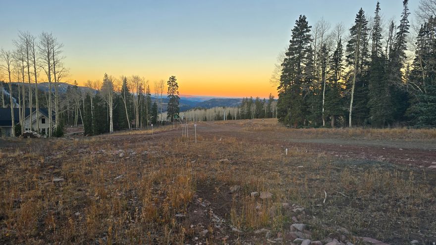 A truly unique opportunity, this 0.48-acre lot is located on the Glacier Glade ski run within the prestigious Aspen Crest gated community. This lot offers an exceptional building profile and is situated near the future town square. Aspen Crest residents enjoy signature sunset views down Beaver Canyon that are truly breathtaking. All essential utilities, including electric, water, and fiber, are already extended to the subdivision. Aspen Crest is renowned as the premier ski-in/ski-out community, providing year-round access to a wide range of activities. Whether you're passionate about skiing, fishing, kayaking, or mountain biking, Eagle Point Resort offers something for everyone. Soils testing, perc test, and top survey has been done. Some preliminary driveway prep and tree clearing done.