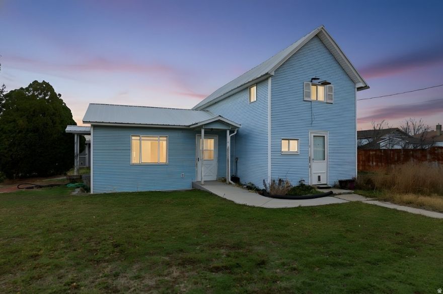 INVESTORS-ARE YOU READY? This is the opportunity you've been waiting for! Charming country property on nearly a full acre, fully fenced, and packed with value and upside. The property includes .91 shares of Bear River Canal, a culinary well, and two parcels, offering flexibility to hold both or potentially sell one separately (buyer to verify). The home, originally built in 1908 with additions over the years, features a metal roof, 3 bedrooms, 2 bathrooms, large rooms, spacious laundry, and main-floor living. The second bathroom has not been used in years and will need TLC. The home has two water heaters, forced-air heating, and no A/C. Outside is where this property truly shines-approximately 2,500 sq ft HUGE shop with power and oversized doors, a large electric gate for security, and an additional shed for storage, hobbies, or equipment. Septic has been recently pumped and inspected. Property is being sold AS-IS and is available to CASH or CONVENTIONAL buyers only. Buyer and Buyer's Agent to verify all information.