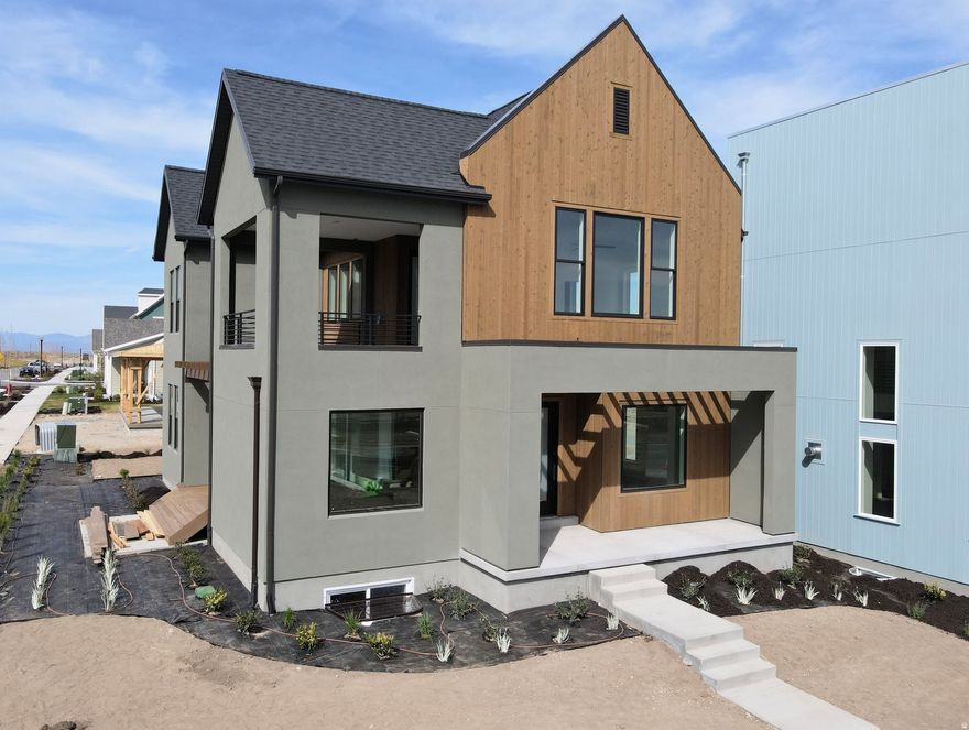 Brand New Corner Lot Home with a brand-new wood exterior! Amazing views of the New Watercourse from the hot tub-ready balcony in this popular Adventurer floor plan! Impressive designer upgrades such as: 9-foot ceilings on all levels, A fireplace, modern railing, coveted indoor/outdoor living layout with oversized sliding glass doors connecting the Great Room and Kitchen with outdoor patio space. The main-level office is filled with natural light thanks to abundant windows perfect for work or relaxation. Upstairs, the dreamy Primary Suite features its own covered, hot tub-ready balcony, along with a luxurious en-suite bathroom complete with a stand-alone soaking tub and a spacious walk-in shower. Estimated completion: May 2026. Photos are of actual home under construction.