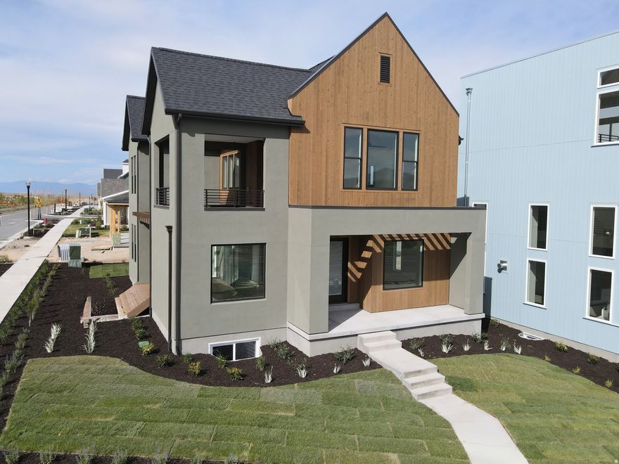 Brand New Corner Lot Home with a brand-new wood exterior! Amazing views of the New Watercourse from the hot tub-ready balcony in this popular Adventurer floor plan! Impressive designer upgrades such as: 9-foot ceilings on all levels, A fireplace, modern railing, coveted indoor/outdoor living layout with oversized sliding glass doors connecting the Great Room and Kitchen with outdoor patio space. The main-level office is filled with natural light thanks to abundant windows perfect for work or relaxation. Upstairs, the dreamy Primary Suite features its own covered, hot tub-ready balcony, along with a luxurious en-suite bathroom complete with a stand-alone soaking tub and a spacious walk-in shower. Estimated completion: May 2026. Photos are of actual home under construction.