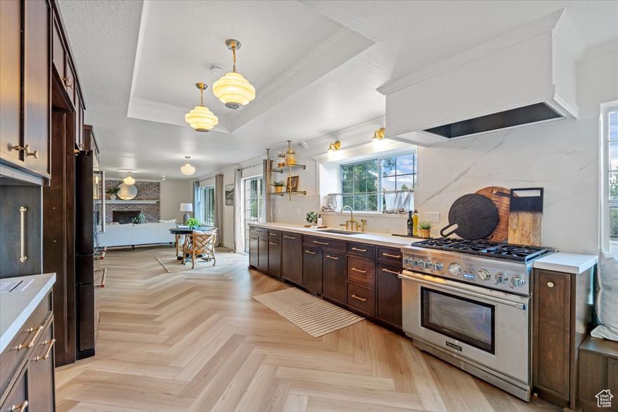 Color drenching is making a comeback! But if it's not your style - the seller is willing to provide a concession for paint.  This home is beautifully remodeled, has paid-off solar, AMAZING VIEWS, and income potential! Inside, you'll love the spacious, light-filled layout designed for both entertaining and everyday living. The great room and kitchen flow seamlessly together-large enough for hosting big gatherings yet cozy enough for quiet winter nights. The kitchen features a hidden butler pantry with extra storage and prep space including sink and double oven.  Your new happy place awaits in the stunning primary suite retreat, complete with a large walk-in closet and a spa-like bathroom. Oversized bedrooms (5 bedrooms on the top level) with generous closets, an abundance of storage, and a dream mudroom-complete with counters, sink, and workspace-make this home as practical as it is beautiful.  Sitting on a .46-acre lot, the property provides ample space to add a second garage or shop, giving you room to grow or create your ideal workspace.  This property is also a smart investment in comfort and sustainability. With an abundance of owned solar panels and a 14 kWh battery backup, you'll enjoy energy savings, optimal backup power, and peace of mind. Roof and mechanicals are in excellent condition, and a brand-new second AC unit has just been added.  The fully finished walkout basement features a separate entrance, laundry, and flexible layout-perfect as an income-producing 1 or 2 bedroom ADU, guest quarters, or extra entertainment space.  With its combination of style, function, and financial upside, this Alpine gem is more than a home-it's a lifestyle.  Call today to schedule your private tour!