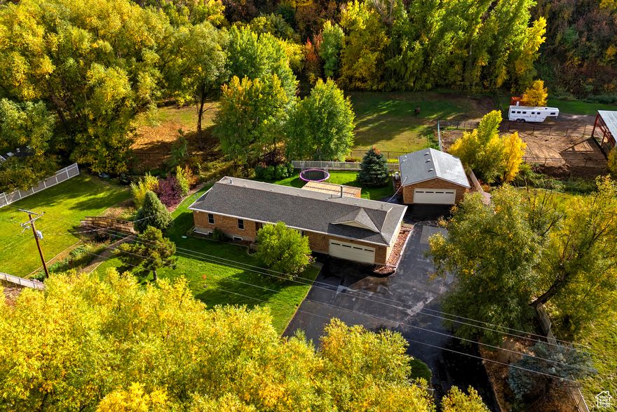 This property is amazing    Mountain retreat, 0.81 acre HORSE property in Peoa, where two trout streams and a mini-waterfall converge on your property, creating running water year-round for your furry critters! Plus frequent deer visitors!!     Mature landscaping, fully fenced yard, running water = peaceful, campground-like setting, but with everyday comforts!   Single-level living with updated baths, flooring, windows, paint, and abundant light.   Lower level adds 2 bedrooms, office/den, family room, play space, plus a private entrance with room for a future kitchen-ideal for a Mother-in-Law or ADU.   Cozy radiant heat and a wood-burning stove. Utilities here are almost non-existent!  plus your annual water cost - only $75! *That's for the house and the lawn!  Heated workshop, (220pwr), great man cave space, storage, etc.   Loads of assault parking for toys and turnaround space for trailers!      Minutes from Rockport Reservoir, Weber Canyon, and Park City's ski resorts, this property delivers adventure in every direction.   With convenience, recreation, and tranquility all in one rare package, Even the locals say it's one of the prettiest spots around!   **Purchase includes .21 acre side parcel zoned agriculture 10** Information deemed reliable but not guaranteed. Buyer to verify all info.