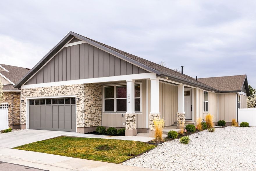 This beautifully crafted custom rambler is located along a picturesque lane in Salt Lake City's Sugarhouse Place subdivision, offering a thoughtful blend of modern design, refined finishes and comfortable living spaces. Carefully designed with both style and everyday functionality in mind, the residence features a thoughtfully-considered layout that seamlessly connects the kitchen, dining and family areas under soaring vaulted ceilings. The main living spaces are filled with natural light and designed for effortless living and entertaining. A semi formal dining area flows naturally into the gourmet kitchen and inviting family room, creating a welcoming central gathering space. The kitchen is beautifully appointed with custom cabinetry, quartz countertops, a spacious island with seating for four, a gas range with hood and a built-in pantry. The adjacent family room offers generous space forunwinding, highlighted by a custom-built mantel and gas fireplace. Sliding door access to the back patio extends the living space outdoors, ideal for entertaining or enjoying quiet evenings at home. The main level features two bedrooms, including a well appointed primary suite complete with its own gas fireplace, a dual vanity, soaking tub and Euro glass shower. A secondary ensuite bedroom provides additional comfort and privacy for guests or family members. A bank of custom storage lockers, a laundry room with sink and a convenient powder bath complete the main level. The lower level boasts impressive nine-foot ceilings and a spacious secondary family room anchored by another gas fireplace. Three additional ensuite bedrooms provide flexibility for visiting guests, while a generous storage room adds practical convenience. Ideally located near Sugar House Park with quick access to major freeway corridors, this home offers peaceful neighborhood living and convenient proximity to the best dining, shopping and cultural amenities that define Salt Lake City.