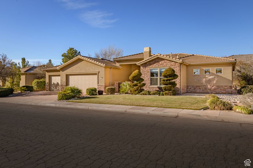 Experience refined living in the sought-after Sunbrook Communities. This elegant 4-bedroom, 4-bath home features a private casita with separate entrance, two fireplaces, and solid-core 8-ft doors. Enjoy seamless indoor-outdoor living with an inviting patio and outdoor fireplace-perfect for entertaining. The spacious 4-car garage offers room for vehicles and recreation gear. Conveniently located in the heart of St. George, close to hiking, biking, and Sunbrook's exceptional amenities, this home embodies the Southern Utah lifestyle of comfort, beauty, and relaxation.