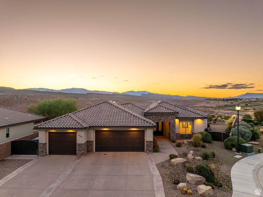 This is your front-row seat to Southern Utah's most breathtaking show. This 3,076 sq. ft. custom-built home rests on a private .74-acre lot atop Tuscany Hills, offering unobstructed panoramic views of the iconic red rocks. Designed and lovingly maintained by its original owner, the home was built for gathering indoors and out. The chef-inspired kitchen features GE Profile appliances, generous counter space, and an open layout perfect for entertaining. Each of the three spacious bedrooms includes its own ensuite bath, complemented by a guest powder room for convenience. The expansive primary suite includes a custom closet with direct access to the laundry room, combining luxury with practicality. Plenty of storage and a true three-car garage that spans 1,061 sqft and 29 feet deep plenty of room for vehicles, toys, and more. Outside, the low-maintenance yard invites relaxation with a fire pit, water feature, and covered patio all designed to maximize those unforgettable red rock views.