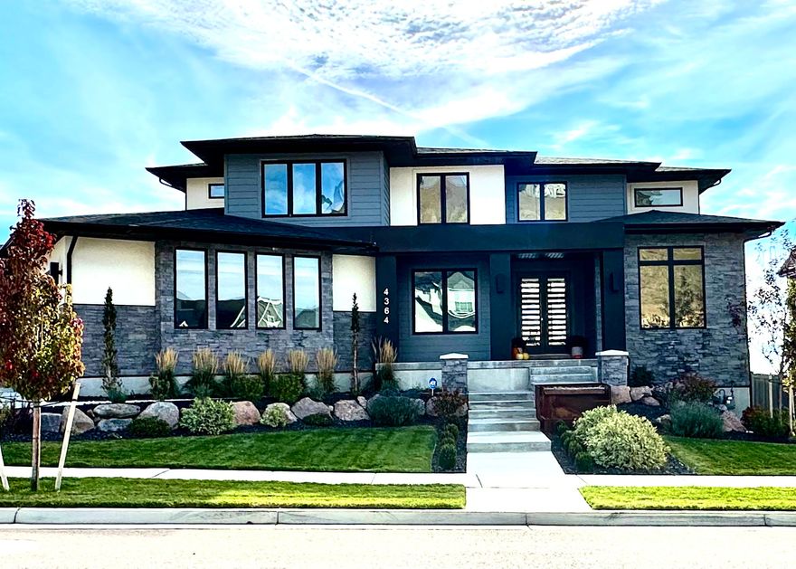 Welcome to Williams View, Highland's premier luxury community-where your dream home is ready to be brought to life. This to-be-built, two-story custom estate blends striking contemporary architecture with high-end finishes and thoughtful design throughout. Situated in a stunning mountain-view neighborhood, this home is the perfect fusion of elegance, comfort, and functionality.  Step inside to soaring 19-foot ceilings in the main living area and 9-foot ceilings throughout the rest of the home, creating an open and airy atmosphere. The main-floor master suite is a private retreat featuring a gas fireplace, luxurious steamer shower, double vanity, and a custom-designed closet with built-in shelving and a stackable washer/dryer. The main level also offers a den, a flexible office/bedroom space, a stylish half bath, and a warm family room with a second gas fireplace.  The gourmet kitchen will impress with a premium Sub-Zero appliance package, custom designer cabinetry, and sleek finishes. Engineered hardwood, plush carpet, and custom tile flooring flow seamlessly from room to room. The spacious 4-car garage adds convenience, and both the covered front porch (with cold storage) and covered back patio are ideal for relaxing or entertaining year-round.  Upstairs, you'll find two spacious bedrooms, a full bath, laundry room, and a versatile loft-perfect for a second living space, homework zone, or reading nook.  The fully finished basement is an entertainer's dream: complete with a walkout entrance, kitchenette, tiered theater room, exercise room, two additional bedrooms, and a full bath.  High-efficiency black vinyl windows, stone/stucco/metal exterior accents, and thoughtful details throughout complete this custom masterpiece.  Your vision, your finishes, your forever home-welcome to modern luxury in Williams View.   Floor plan and photos are provided as an example of what could be built. Choose from one of many floor plans.   Use our builder or bring your own!  Square footage is provided as a courtesy estimate only and was obtained by builder plans. Buyer is advised to obtain an independent measurement.