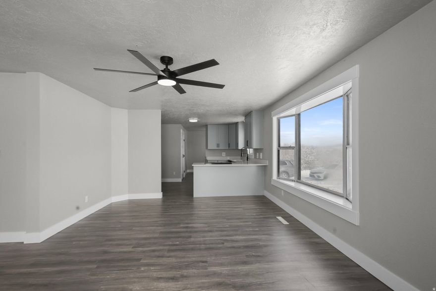 Welcome to peaceful country living in Weston Id, where wide-open skies and mountain views surround this beautifully remodeled 3-bedroom, 2-bath home set on 11.93 private acres. Completely renovated in 2025, this property offers the rare combination of modern finishes and rural charm, giving you the space you want with the upgrades you don't have to worry about. Inside, the home has been thoughtfully updated from top to bottom. The kitchen features brand-new appliances, quarts countertops, and new cabinetry designed for both style and function. Both bathrooms have been completely redone with fresh, contemporary finishes. All new LED lighting brightens the home throughout, while ceiling fans in the upstairs bedrooms and living room add comfort and efficiency. French doors open to closets equipped with built-in organizers, providing a polished look and practical storage. A smart thermostat enhances convenience and energy management, and a brand-new roof installed in 2025 offers long-term peace of mind. The lower level includes a family room, bathroom, bedroom and two bonus rooms that provide flexibility for a home office, gym, guest quarters, hobby space, or additional storage. A two-car garage adds everyday practicality, while the nearly 12 acres of land offer endless potential for animals, recreation, gardening, or simply enjoying the privacy and quiet of the countryside. The home is serviced by a private spring well, and the propane tank is rented. This move-in-ready property delivers modern comfort in a serene Idaho setting, making it an exceptional opportunity for anyone seeking acreage, updates, and room to breathe just outside of town. The buyer and buyer agent are responsible to verify all listing information, including square feet/ acreage, to the buyer's own satisfaction. Don't miss your chance to see it-call today to schedule your private showing!