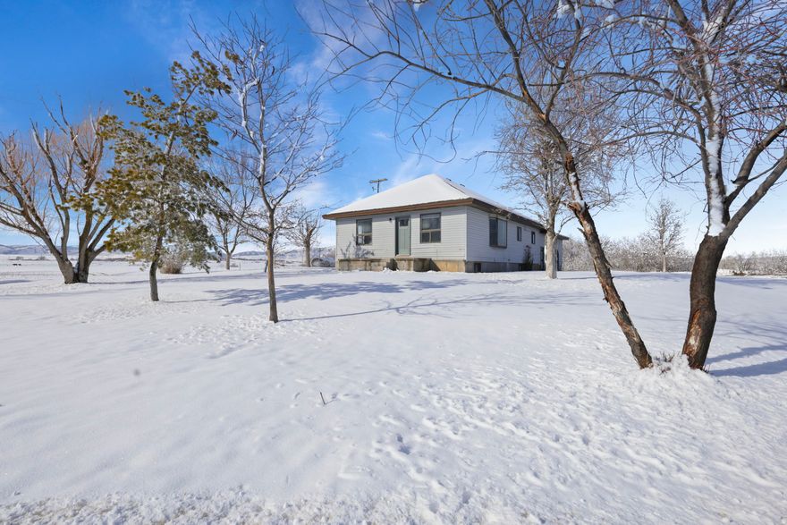 Welcome to peaceful country living in Weston Id, where wide-open skies and mountain views surround this beautifully remodeled 3-bedroom, 2-bath home set on 11.93 private acres. Completely renovated in 2025, this property offers the rare combination of modern finishes and rural charm, giving you the space you want with the upgrades you don't have to worry about. Inside, the home has been thoughtfully updated from top to bottom. The kitchen features brand-new appliances, quarts countertops, and new cabinetry designed for both style and function. Both bathrooms have been completely redone with fresh, contemporary finishes. All new LED lighting brightens the home throughout, while ceiling fans in the upstairs bedrooms and living room add comfort and efficiency. French doors open to closets equipped with built-in organizers, providing a polished look and practical storage. A smart thermostat enhances convenience and energy management, and a brand-new roof installed in 2025 offers long-term peace of mind. The lower level includes a family room, bathroom, bedroom and two bonus rooms that provide flexibility for a home office, gym, guest quarters, hobby space, or additional storage. A two-car garage adds everyday practicality, while the nearly 12 acres of land offer endless potential for animals, recreation, gardening, or simply enjoying the privacy and quiet of the countryside. The home is serviced by a private spring well, and the propane tank is rented. This move-in-ready property delivers modern comfort in a serene Idaho setting, making it an exceptional opportunity for anyone seeking acreage, updates, and room to breathe just outside of town. The buyer and buyer agent are responsible to verify all listing information, including square feet/ acreage, to the buyer's own satisfaction. Don't miss your chance to see it-call today to schedule your private showing!