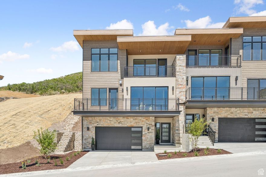 The new Klaim townhomes feature 88 expertly designed 3 to 4 bedroom floorplans overlooking the Jordanelle Reservoir. Each featuring an expansive layout with a 2-car garage; a sliding glass wall that allows residents to experience the breathtaking views; and a modern, timeless design throughout. With approximately two thirds of the land preserved as open space, the Klaim Townhomes provide residents access to miles of trails in which to walk, run, hike, and bike. Model open daily. Buyer to verify Info