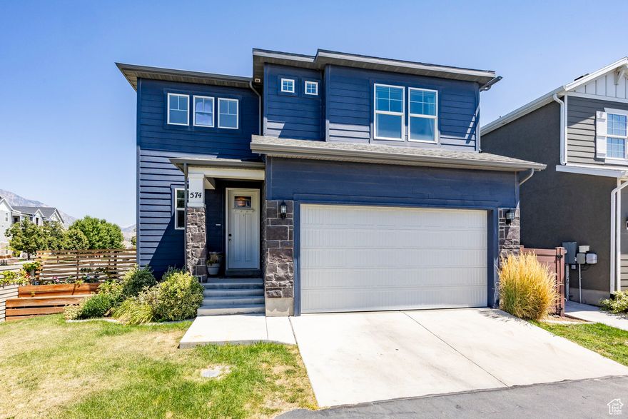 Experience the best of Utah living in Vineyard, a growing community in Utah Valley.Just minutes from the shoreline of Utah Lake, you'll have easy access to paddleboarding and scenic shoreline paths for running, walking, biking, and, if you're feeling adventurous, rollerskating. Within a half-mile are three city parks featuring pickleball, tennis, splash pads, shaded playgrounds (including a sand and water park), and multiple picnic areas. Two nearby community clubhouses offer outdoor pools, play areas, and outdoor gas fireplaces. Enjoy a low-maintenance lifestyle with a cozy backyard complete with turf and a paver patio, or unwind in the large soaking tub after a full day of work or play. Smarthome features add convenience, control your sprinklers, furnace, AC, and smart lock right from your phone. The home is also plumbed for a water softener. The nearby Frontrunner station provides quick access to UVU, downtown Provo, and Salt Lake City. And when it's time to escape to the mountains, you're just a short drive from world-class skiing, scenic canyons, and year-round outdoor adventure. Conveniently located near I-15, shopping, dining, entertainment, and medical care. Plus, with the future Utah City development on the horizon, this home puts you at the center of what's next.