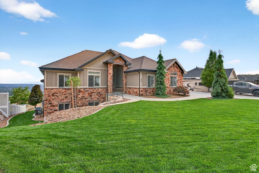 Located in a prime North Ogden location, this immaculate home is the one you've been waiting for. With panoramic mountain and valley views, it's easy to fall in love before you even step inside.  Including a fully finished walk-out basement featuring a complete ADU-perfect for guests, rental income, or multi-generational living. It includes its own full kitchen, private laundry, three bedrooms (including a second primary suite), and a separate entrance. Upstairs, you'll find an inviting open layout, rich wood cabinetry, granite counters, and a cozy island ready for gathering. Movie nights just got an upgrade thanks to the full theater room downstairs. Homes like this don't come around often-move-in ready, beautifully cared for, and set up to meet all your needs. As a bonus, the seller is willing to offer a credit to paint the interior of the home!