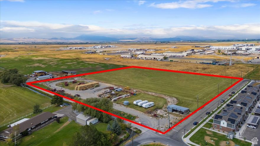 This is a rare chance to acquire nearly 10 acres of strategically located land in the rapidly growing North Logan corridor. Zoned for light industrial, commercial, or agricultural use, the property offers outstanding flexibility and is well-positioned for a wide range of development opportunities. Essential infrastructure is already in place, including sewer access on two sides, culinary water along the east boundary, and power on site-making this a highly functional and development-ready parcel. The sale also includes 10 valuable irrigation shares, supporting both agricultural use and future landscaping needs. The seller is open to a lot line adjustment, offering versatility for phased development or smaller-scale buyers. Additionally, adjacent acreage and a residential home to the south are available for purchase, providing further potential for expansion. With high visibility, strong long-term upside, and alignment with North Logan's master plan, this property presents a unique investment opportunity in a dynamic and fast-growing market. Buyer to verify all information.