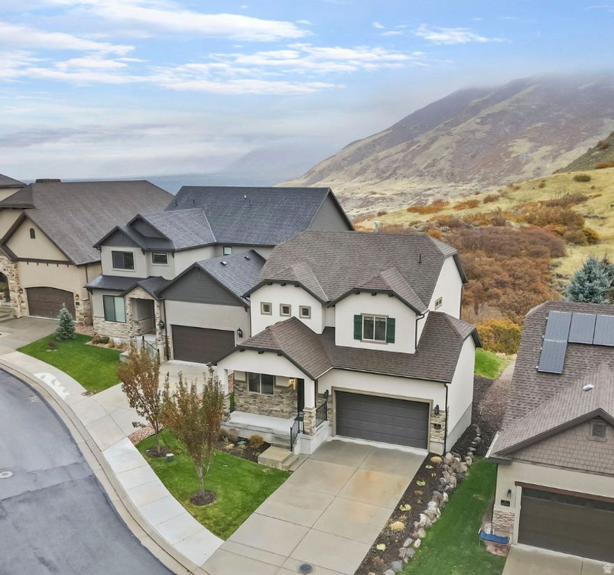 This was a featured home on ABC4's Real Estate Essentials, check out the attached video! Welcome to a rare opportunity to live in one of Draper's premier million dollar neighborhoods, Montreaux, located in the heart of Corner Canyon. This home offers breathtaking views both day and night, with direct backyard access to an extensive network of hiking and mountain biking trails. Meticulously cared for and maintained, this residence feels like new and stands out as one of the most pristine homes in the area. Inside, you'll find elegant granite countertops, premier finishes, and a layout designed for both comfort and style. Enjoy easy living with the HOA covering all landscaping, allowing you more time to relax and take in the surrounding beauty. Situated above the city, residents enjoy cleaner air and noticeably cooler summer temperatures, all within top-rated school boundaries and just five minutes from I-15. Experience the perfect blend of convenience and tranquility in your private retreat away from the city hustle and seasonal inversion. Square footage figures are provided as a courtesy estimate only and were obtained from county records.  Buyer is advised to obtain an independent measurement.