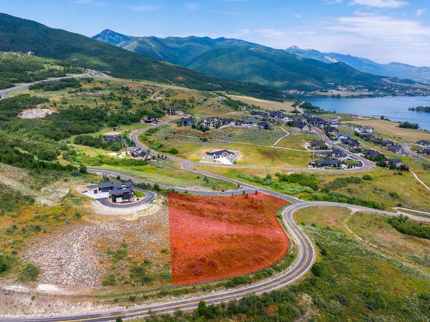 Lot 40 in Legacy Mountain Estates is 4.11 acres with jaw-dropping views of Pineview Reservoir, the open valley, and the snow-capped Wasatch Range. It sits at the entrance of one of Ogden Valley's most loved communities with 280 wooded acres, just 48 estate lots, and the kind of natural beauty that makes you stop the car and get out. Snowbasin is four miles away. Powder Mountain isn't far behind. You get the seclusion without giving up world-class skiing and mountain access. The lot is ready to move on. Water and sewer connection fees are already paid, utilities are stubbed and available, and the gradual slope gives you real flexibility in how you design and build. HOA is a flat $175/month covering common areas, trails, and entry monuments - straightforward and reasonable for a community of this caliber. If you've been looking for the right site to build a mountain estate that means something, this is it.