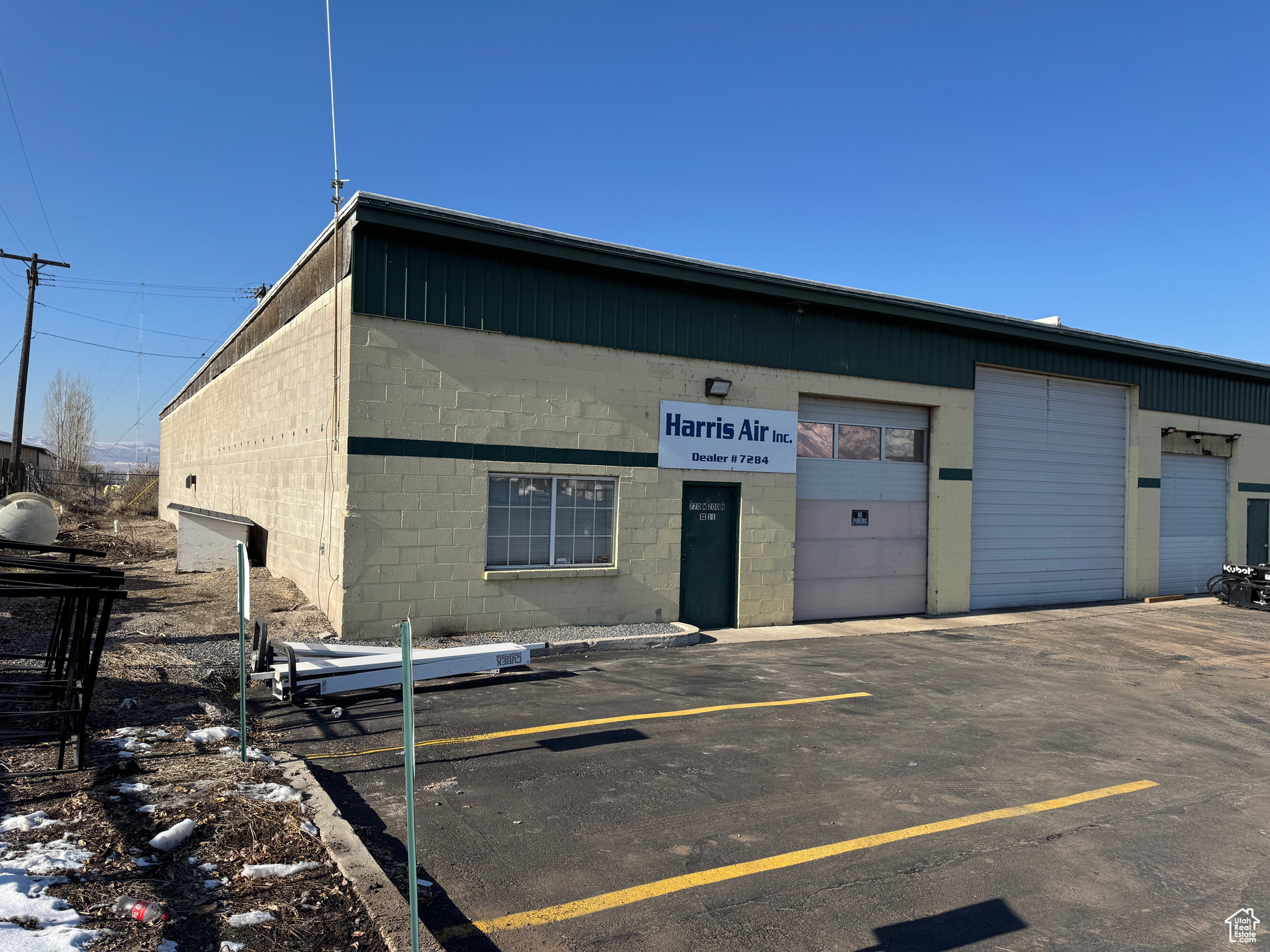 West Logan Industrial space. 3,322 SF with small office, private bathroom and open shop space. 12' x 12' overhead door. Shop floor drain. End unit with 3 parking stalls.