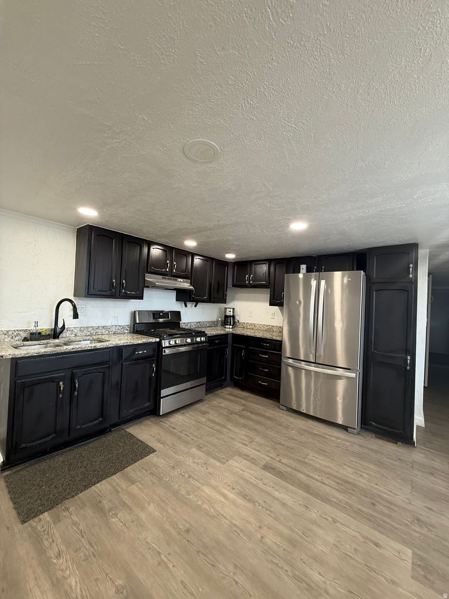 This fully remodeled home offers comfort, style, and plenty of space for the whole family. Enjoy peace of mind with a newer roof and the convenience of a covered parking area for up to four cars. The property features a large front porch perfect for relaxing evenings and a spacious yard ideal for gatherings, and playtime. With its open, spacious layout this home is ready for you to move in and make it your own. This includes a big 12x12 shed.