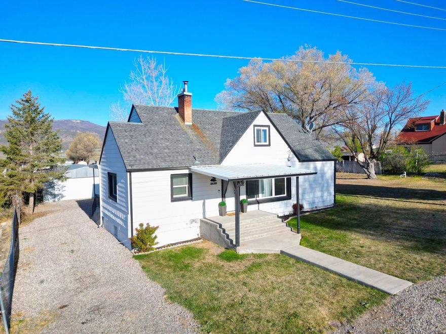 Rare opportunity to own affordable country living with usable land and valuable extras in Moroni. This well-maintained home sits on .53 acres-offering space for horses, livestock, chickens, gardening, and more, all in a peaceful rural setting. Inside, you'll find a functional layout with a large eat-in kitchen, inviting living room, spacious laundry area, and two bedrooms on the main level. Upstairs adds a third bedroom, a versatile rec room with storage, and a cozy nook-giving you flexible space for a variety of needs. The home is well positioned on the lot to maximize land use, with room to expand in the future. The powered two-car detached metal garage adds significant value, providing ample space for parking, storage, or projects. This property comes loaded with extras, including a covered storage container, chicken coop with enclosure, basement deep freezer, and kitchen refrigerator. Washer, dryer, and pool table are negotiable-making this a true move-in-ready opportunity with added value throughout. Located just 15 minutes from Snow College, shopping, and outdoor recreation, you get the best of rural living without sacrificing convenience. Buyer to verify all information. Square footage is a courtesy estimate from county records; buyer is advised to obtain independent measurement.