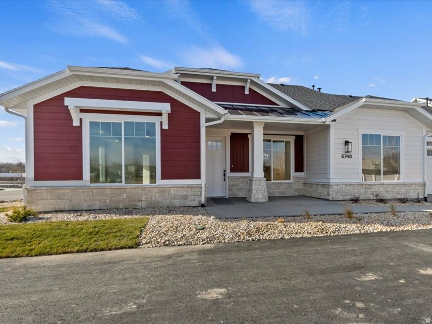 Welcome to The Cottages at Pearce Farm, Salt Lake valley's newest gated community.  Move in ready unit with an open concept floor plan all on one level.  Light filled living space with modern finishes.  Upgraded cabinets, Quartz countertops, large kitchen island that is perfect for entertaining.  Double ovens.  Upgraded flooring.  Covered patio.  Spacious two-car garage with 327 sq. ft. of storage above.