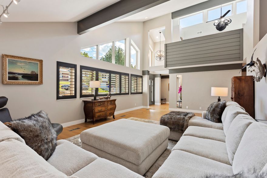 Perched high in the coveted Moss Hill neighborhood, this 7,073 sq ft estate blends elevated design with unforgettable valley views. Soaring vaulted ceilings with exposed beams, statement lighting, and walls of windows flood the home with natural light while framing the landscape below.  At the heart of the home, the remodeled chef's kitchen is both stunning and functional-featuring quartz countertops, custom cabinetry, double wall ovens, a gas cooktop, and an oversized island that flows effortlessly into the great room and dining space. Entertain with ease or step outside to the private deck and take in the sweeping city views.  The primary suite is a true retreat, complete with balcony access and a spa-inspired ensuite showcasing dual vanities, a soaking tub, and a beautifully tiled walk-in shower.  The walkout lower level offers a fully equipped mother-in-law apartment with its own kitchen and living space-perfect for multi-generational living, guests, or strong income potential.  Car enthusiasts, hobbyists, or anyone needing space will appreciate the expansive garage, complete with a dedicated workshop area and abundant storage-offering both function and flexibility rarely found at this level.  With 5 bedrooms, 5 bathrooms, and over 7,000 square feet of thoughtfully updated living space, this is more than a home-it's a lifestyle in one of the area's most sought-after settings.