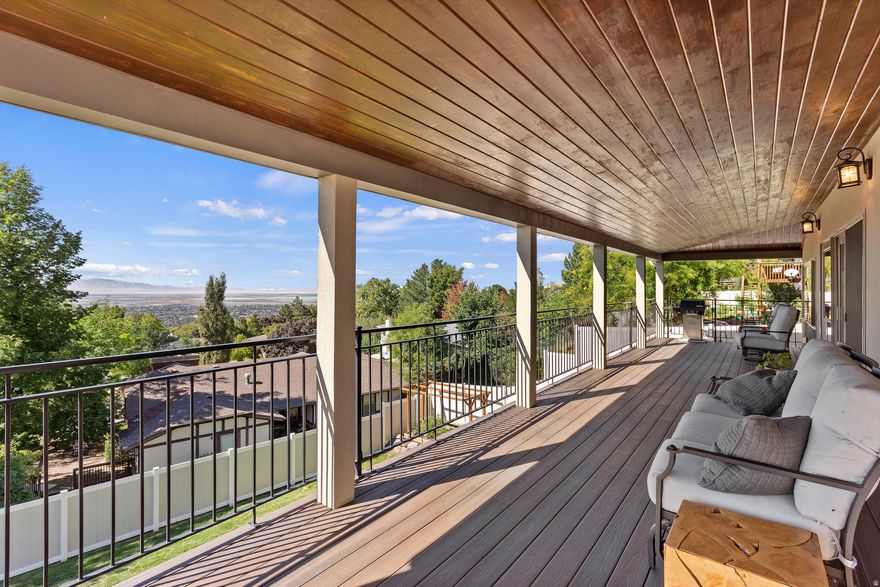 Perched high in the coveted Moss Hill neighborhood, this 7,073 sq ft estate blends elevated design with unforgettable valley views. Soaring vaulted ceilings with exposed beams, statement lighting, and walls of windows flood the home with natural light while framing the landscape below.  At the heart of the home, the remodeled chef's kitchen is both stunning and functional-featuring quartz countertops, custom cabinetry, double wall ovens, a gas cooktop, and an oversized island that flows effortlessly into the great room and dining space. Entertain with ease or step outside to the private deck and take in the sweeping city views.  The primary suite is a true retreat, complete with balcony access and a spa-inspired ensuite showcasing dual vanities, a soaking tub, and a beautifully tiled walk-in shower.  The walkout lower level offers a fully equipped mother-in-law apartment with its own kitchen and living space-perfect for multi-generational living, guests, or strong income potential.  Car enthusiasts, hobbyists, or anyone needing space will appreciate the expansive garage, complete with a dedicated workshop area and abundant storage-offering both function and flexibility rarely found at this level.  With 5 bedrooms, 5 bathrooms, and over 7,000 square feet of thoughtfully updated living space, this is more than a home-it's a lifestyle in one of the area's most sought-after settings. Call Sally at 949-274-5866 for a showing.
