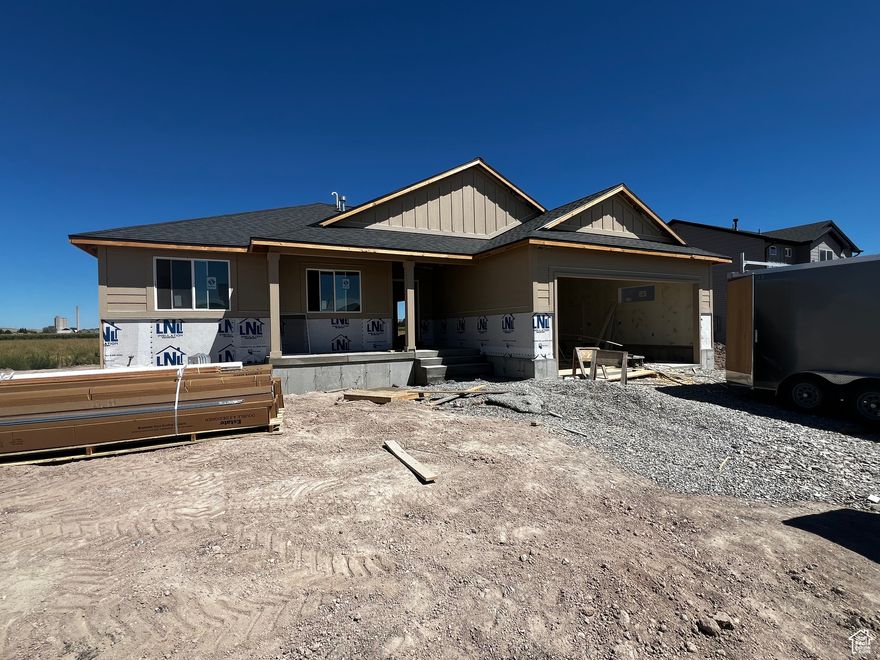 Brand New Rambler in Eastside View!   Welcome to this beautifully crafted 3-bedroom, 2-bath home in the desirable Eastside View subdivision of Garland, Utah. Featuring a spacious open-concept floor plan, vaulted ceilings, and abundant natural light, this home is perfect for modern living. The kitchen boasts stylish finishes, ample counter space, and a functional layout that flows seamlessly into the dining and living areas. Enjoy the comfort of a private primary suite with a walk-in closet and ensuite bath. Exterior highlights include an attractive rock and vinyl finish, a 2-car garage, and a prime lot with scenic views.   Act now and you may still have time to choose select colors and finishes to make this home uniquely yours! No HOA means more freedom to enjoy your property your way. Conveniently located near schools, parks, and all that Box Elder County has to offer!