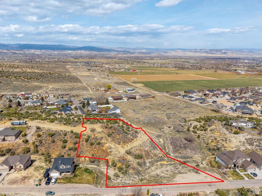 Nestled in the heart of Utah's stunning Uintah Basin, this spacious 1.97-acre building lot is in the elite Air Village Hills and offers exceptional views, wide open skies, and the rugged natural landscape that makes this region so special.  Perfect to build your dream home on or to invest in the land with potential.  Enjoy the privacy of feeling tucked away with  convenient access to local amenities.  Utilities are stubbed and a water line runs across the width of the property.  Lot is large enough to possibly be divided into two separate parcels.  Buyer to verify all Information.