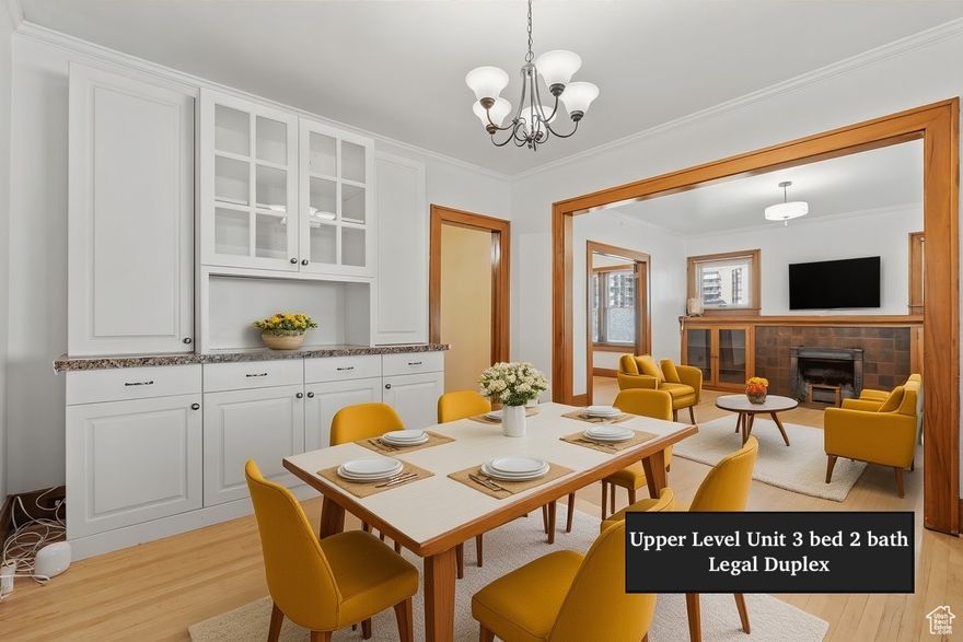 Charming Lower Avenues Craftsman bungalow-legal duplex with two above-ground units. Over/under layout with minimal basement feel. Features two driveways, backyard with retaining walls and sewer connection (potential detached ADU), and separate electric meters. High-efficiency gas boiler provides heat and hot water, has two fireplaces. Prime walkable location near Temple Square and downtown. Strong rental history: upper previously $2,700 (vacant, easy to show); lower rented  $1,800 with flex option for 60-day notice to end. Tenants would live to stay! All utilities paid by tenants. Sellers relocating overseas. *willing to look at Seller financing offers with a considerable/strong down payment*