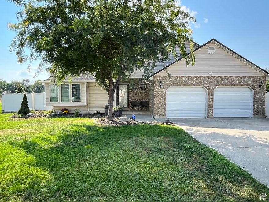 Welcome to this beautiful, MOVE-IN-READY 5 bedroom 3 bath home in Perry.   The vaulted ceilings and open floor plan make this home comfortable, inviting and spacious.   The window benches in the living room are a welcome and cozy plus to the family room.  The kitchen and dining areas are very functional and there is a lot of counter space along with a nice sized pantry.  Downstairs you will find 2 bedrooms a bathroom and a large gathering room with tons of space to play games, entertain or just relax and watch TV.  The basement has been plumbed for a wet bar.   The yard is fully fenced and has a full sprinkling system and a storage shed.  The furnace and Air Conditioning unit has recently been replaced along with a newer water heater.  This home has a lot to offer.  Come take a look.   Square footage figures are provided as a courtesy estimate only and were obtained from county records.  Buyer is advised to obtain an independent measurement.  The loan is assumable to a qualified buyer.