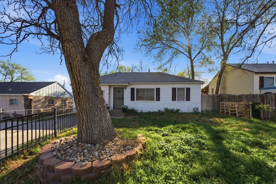 Tucked into a spacious Tooele lot, this cozy home offers endless possibilities. Nestled among mature trees, the fully fenced yard provides space to relax, garden, or just enjoy the outdoors from the shade of the covered patio. Conveniently located near local shops and restaurants, you'll love the blend of comfort and accessibility. Come envision the possibilities and make this space your own.