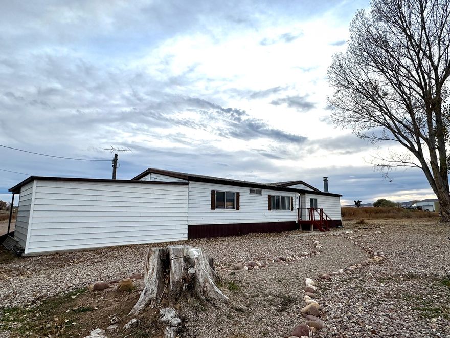 This 3-bed, 2-bath home  sits on 2.5 acres, and is located just around the corner from the golf course! Featuring a fully updated Master bath, a spacious layout, and expansive outdoor space, this property has everything you need! With a prime location and an attractive price point, it's a rare find in today's market. Don't miss the opportunity to make it yours!  Square footage figures are provided as a courtesy estimate only and were obtained from the seller & county records.  Buyer is advised to obtain an independent measurement.