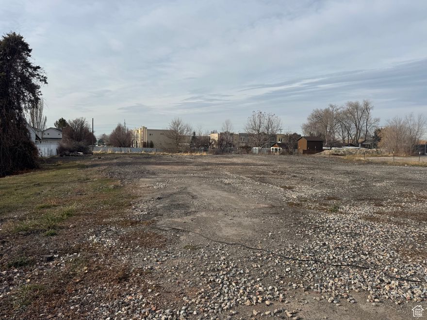 This listing is for a commercial lot lease in the center of Woods Cross City. Land uses for C-1 Commercial Zoning are: Public Use, Quasi Public Use, Retail Sales, Fast Food, and Personal Service.  Use your imagination!  Food Trucks, Christmas Tree Lot, Pumpkin Patch, Farmer's Market, etc. are some of the possibilities. See attached full list of potential uses. The owner is not willing to develop the property at this time, but they are willing to make improvements like leveling, filling, and adding more milled pavement. Great central location.  Drive by and call with questions.