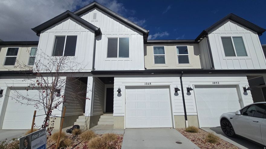 Beautiful townhome in a great neighborhood. Located on the Lehi/Saratoga Springs border - close to shopping, schools, parks and trails. This home includes a main bedroom with walk-in closet, quartz countertops, stainless-steel appliances, one car garage and driveway and a smart home system. Enjoy hassle-free living, pool access, multiple parks, pickleball courts and a clubhouse for entertaining. Home Warranty, Active Radon Mitigation System, and Smart Home Package all included. please conduct your own survey regarding current/future school boundaries. Square footage estimates are provided as a courtesy only.