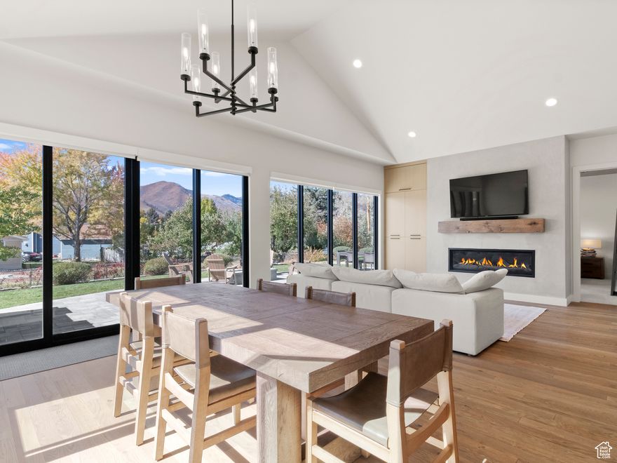 Welcome to Remund Farms! This exceptional home blends timeless design with modern comfort, featuring an open floor plan, abundant natural light, 14-foot ceilings and premium finishes throughout the property. The spacious living room offers beautiful hardwood floors and a large gas fireplace, perfect for cozy evenings or entertaining guests. The gourmet kitchen is a chef's dream, showcasing a large quartz island and countertops, custom cabinetry, and an extended walk-in pantry, ideal for everyday living or hosting gatherings. The main-level primary suite is a serene retreat and includes a walkout to the back patio, dual vanities, double closets, an oversized shower, and a private water closet. The second bedroom on the main level also includes an ensuite 3/4 bathroom, and the third bedroom currently serves as a stylish home office with built-in cabinetry and a sliding door to the front porch. Upstairs is home to three additional bedrooms, 1 full bathroom and a 3/4 bathroom along with the second living room and gym room.  The backyard boasts a large paver patio with a built-in gas fire pit, gas bbq and smoker. Front driveway also was built with pavers and other premium finishes include a ceiling electric heater on the front porch/patio, and in the garage there is also heat along with hot and cold water, built in cabinetry and epoxy flooring.   Residents of Remund Farms enjoy world-class amenities, including pickleball and basketball courts, a clubhouse with fitness center, swimming pool, playground, and a kids' clubhouse. Scenic walking paths, ponds, streams, and fountains create a peaceful, resort-like setting.  Conveniently located near charming Main Street Midway, this home is minutes from premier outdoor recreation-fly fishing, mountain biking, hiking, skiing, and golf-as well as Deer Creek and Jordanelle reservoirs for boating and water sports.