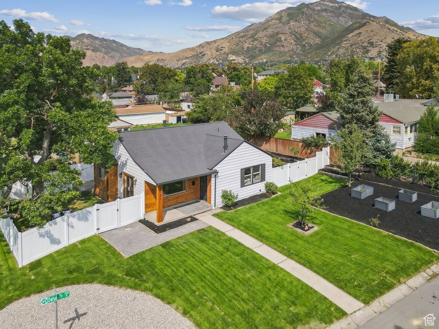 This Is The One  Fully Renovated Holladay Luxury with Unmatched Views. Stop scrolling-you've just found the one. This isn't just another Holladay listing; it's a rare, down-to-the-studs, fully permitted renovation where every inch has been reimagined for modern luxury and comfort. From the brand-new HVAC, windows, plumbing, and electrical to the rich hardwood floors, cedar siding accents, and fresh designer finishes, this home is 100% move-in ready-no to-do list, no compromises. The gourmet kitchen will make you fall in love with cooking again-quartz countertops, sleek cabinetry, countertop range, wall oven, pot filler, and a breakfast peninsula perfect for morning coffee or evening wine with friends. The light-filled living room frames jaw-dropping Mt. Olympus views through its picture window and flows seamlessly to your private patio and fenced backyard oasis. Your primary suite is pure indulgence: heated floors, a wall-mounted toilet, a Euroglass shower, and a walk-in closet you'll want to show off. Upstairs also offers a second bedroom and full bath, while the lower level provides two more bedrooms and a generous double-sink bath-ideal for guests, family, or a home office. Outside, a corner lot maximizes privacy and play space, complete with fruit trees (apple, pear, peach, cherry), space for a vegetable garden, new vinyl fencing, and full sprinklers. All of this in a coveted location-top schools, quick canyon access, minutes to dining, shopping, and an easy commute to downtown. Homes like this don't come along often-and when they do, they don't last. This is the one you've been waiting for. See it today before someone else calls it home.