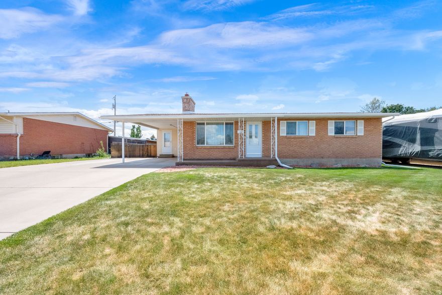 Nestled on a quiet no-through street, this home has been meticulously maintained.  With both the high school and the elementary school just a minute down the street, this home has basically had one single owner since 1963.  They have loved and cared for this home.  The Rood was replaced in 2019.  New water heater in 2020, new AC and furnace in 2017.  They also added a humidifier in 2021.  They installed new upstairs windows in 2020, and the beautiful gas fireplace was updated in 2022, with the mantel updated this very year.  New carpet in the main living space in 2023.  The fully fenced backyard is a beautiful oasis, featuring a covered brick patio and a great garage shop with ample shelving and storage.  All the appliances are included, as well as the potential for a basement apartment with water at the wet bar downstairs and a separate entrance at the back of the home.  Although it doesn't boast of a garage, there is ample parking with the carport and the RV pad.  Square footage provided as a courtesy, and the buyer is advised to get independent measurements.