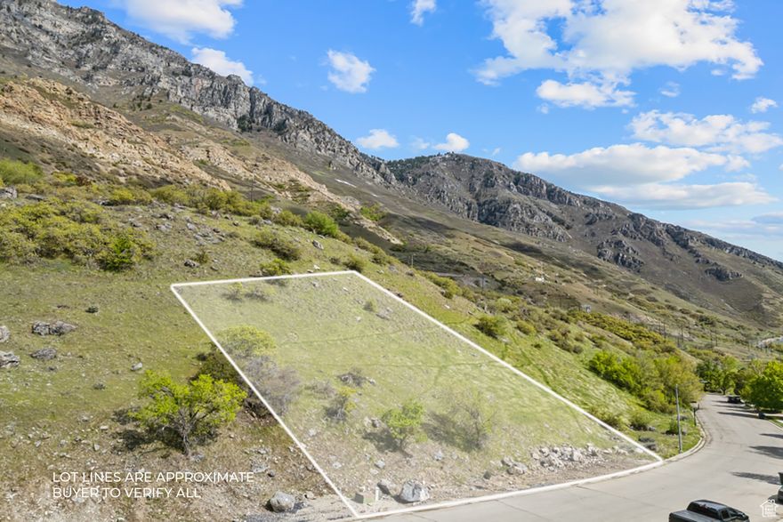 Perched high on the East Bench of Provo near 'Y' Mountain, this 0.36-acre lot has commanding views of the entire Utah Valley from Utah Lake to Mt. Timpanogos. With its elevation, a home built on this lot would provide an impressive mountain experience. Located in Oak Hills close to Provo's historic Center Street, BYU, Rock Canyon Trailhead and Park, and the Provo Rock Canyon LDS Temple (under construction). Set in an established neighborhood with meandering streets, large lots, and many impressive homes. This lot is in Provo's TDR (transferable development rights) zone, which allows for a single-family residence or the potential for a developer to purchase units assigned to this lot to use them as additional/bonus units in a new development elsewhere in Provo while then placing a conservation easement on the lot to remain as open space. NO HOA. Architectural conceptual renderings are available. Buyer to verify all.