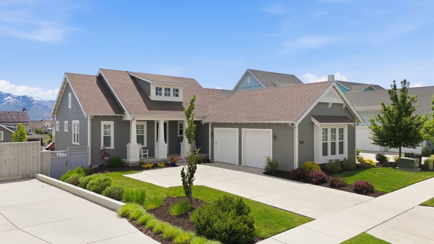 *OPEN HOUSE Saturday, May 23rd 2pm-4pm* One of the premier lots in Daybreak, this rare .21-acre property sits just one block from Oquirrh Lake and offers a flat, pool-ready backyard with lake and mountain views, expansive windows, and incredible natural light throughout. Located within walking distance to trails, parks, waterfront paths, the new Harmons, shopping, dining, and Daybreak's expanding downtown district, this home delivers one of the community's most sought-after lifestyle locations. Designed for indoor-outdoor living, the backyard features a gorgeous green space, natural stone exterior, elevated deck overlooking the lake & mountain views, hot tub, and direct walkout basement access. Inside, the main level features 10+ ft ceilings, a floor-to-ceiling natural stone fireplace, mudroom, dedicated desk area, and open-concept living. The kitchen includes a large island, double oven gas range, and generous storage. The main-floor primary suite offers dual sinks, separate soaking tub and shower, and a large walk-in closet. The daylight walkout basement includes 3 additional bedrooms, full bath, 9-ft ceilings, expansive second living area, cold storage, and plumbing for a future second bathroom. Exceptional lot, views, and location complete this standout Daybreak property.