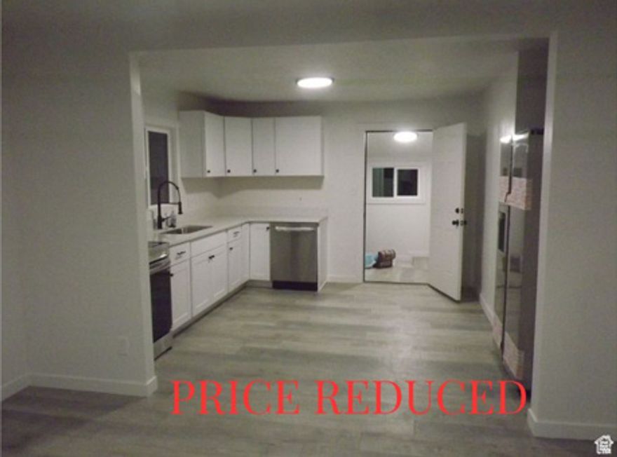 PRICE REDUCED ON BEAUTIFUL HOME. ****BEST DEAL ON THE MARKET WITH MOTHER-IN-LAW APT****   3 bedrooms, 2 full bath, 2 kitchens with granite countertops. New appliances in both kitchens. Everything is brand new remodeled beautifully including a new roof & central air. STOP BY AND BE AMAZED!! PRICE LOWERED AND LOWERED AGAIN. MUST SELL!!