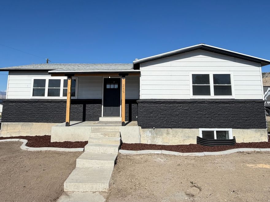 Fully remodeled 4 bed, 2 bath home offering 2,040 sq ft of updated living space. This move-in ready property features a brand new kitchen with quartz countertops, new cabinetry, and all new appliances. Additional upgrades include new central air, windows, doors, garage door, flooring, carpet, baseboards, and fresh texture throughout.  Both bathrooms have been completely updated with new vanities and tiled tubs/showers. The fully finished basement includes new sheetrock, insulation, and texture, along with a separate exterior entrance-ideal for potential rental use or added privacy.  Functional layout offers main level living plus an office or flex space. Additional features include cold storage and a dedicated storage room.  Exterior highlights include a back patio, sprinkler system, large side lot with room for a future shop, and an attached 2-car garage.  Property combines modern updates, flexible living space, and income potential.