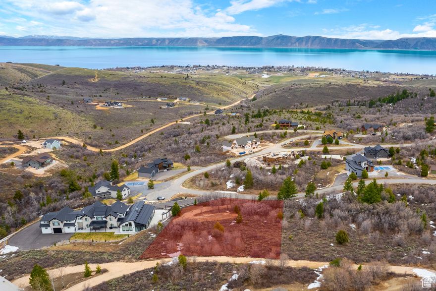 This .98-acre lot located in the desirable Eagle Feather Shundahai is the perfect canvas for your dream home or investment property. Perched in a peaceful setting, this lot offers breathtaking views of Bear Lake and the surrounding mountain ranges while being surrounded by trees for that true lake mountain feel, creating a truly picturesque backdrop for your future build. With nearly a full acre of land, you'll have plenty of space and flexibility to design a custom home, cabin, or income-generating property tailored to your vision. Paved roads make for easy year round access. Whether you're looking for a serene retreat or a long-term investment. Enjoy easy access to outdoor recreation, including boating, hiking, ATV trails, and world-class winter activities-all just a short drive away. Don't miss your chance to own a piece of Bear Lake paradise in Eagle Feather Shundahai!